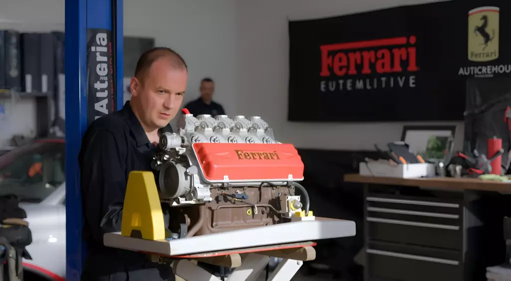 A detailed photo of a skilled mechanic in a modern automotive repair shop, working on a Ferrari engine. The scene shows the Ferrari engine block on a hydraulic lift, surrounded by organized tools, a workbench, and a Ferrari logo on a wall. The lighting is bright and focused, highlighting the precision and craftsmanship of the repair process.