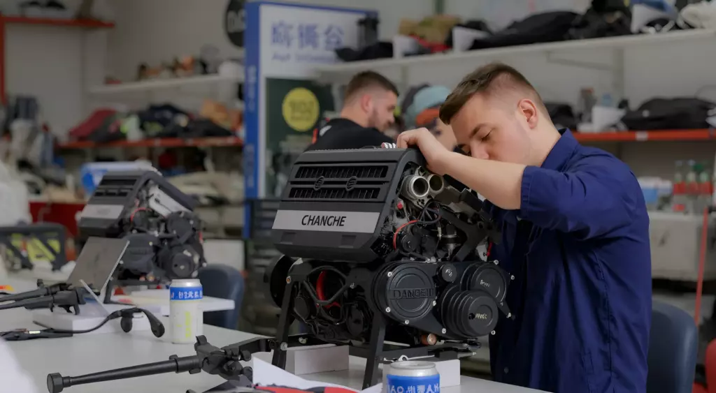 A professional automotive workshop scene showing a skilled mechanic repairing a Changhe engine on a clean workbench, surrounded by engine parts and tools, with a subtle signboard indicating the workshop name.